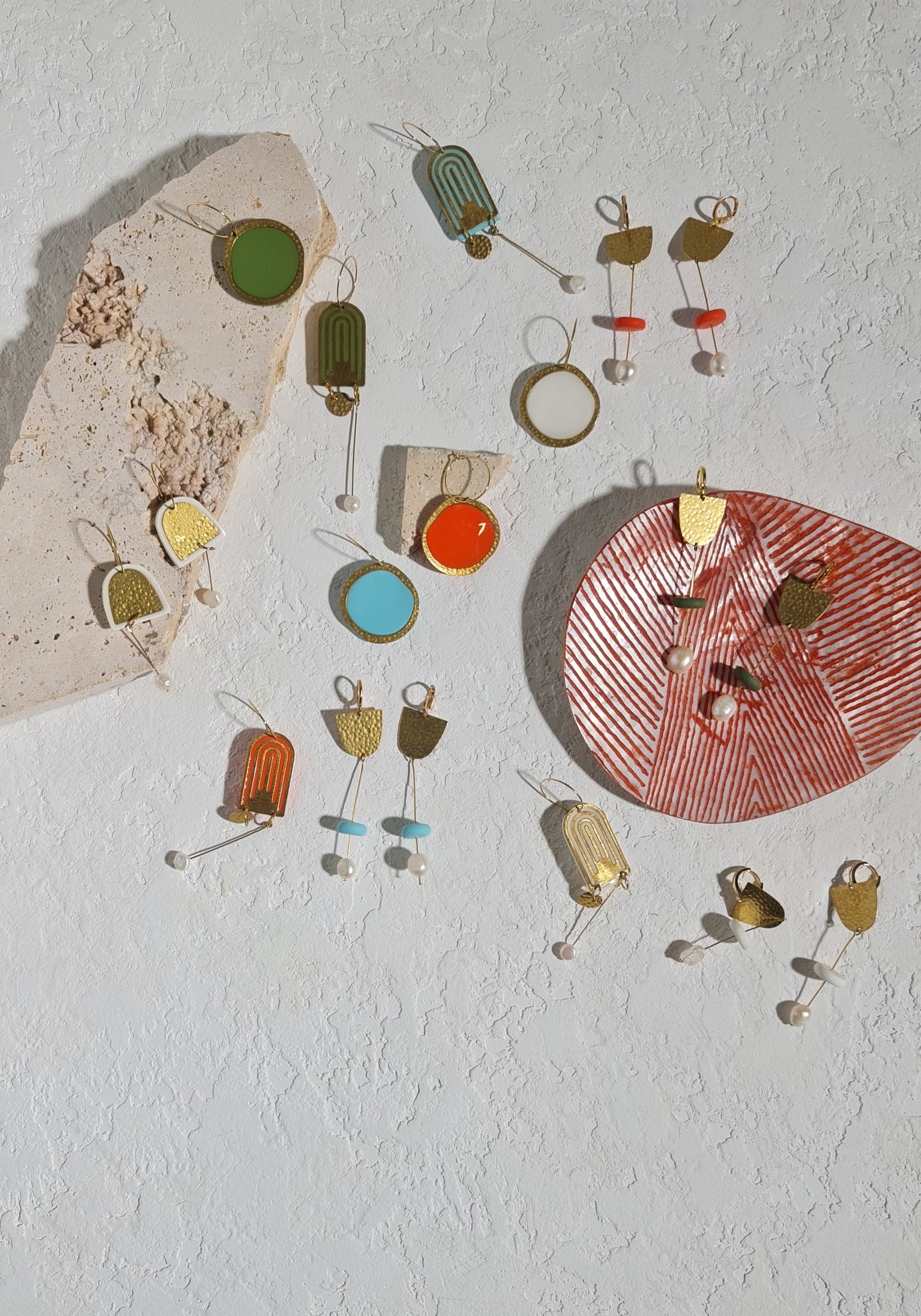 An aerial view of the Colours of Broome earring collection on a white background.