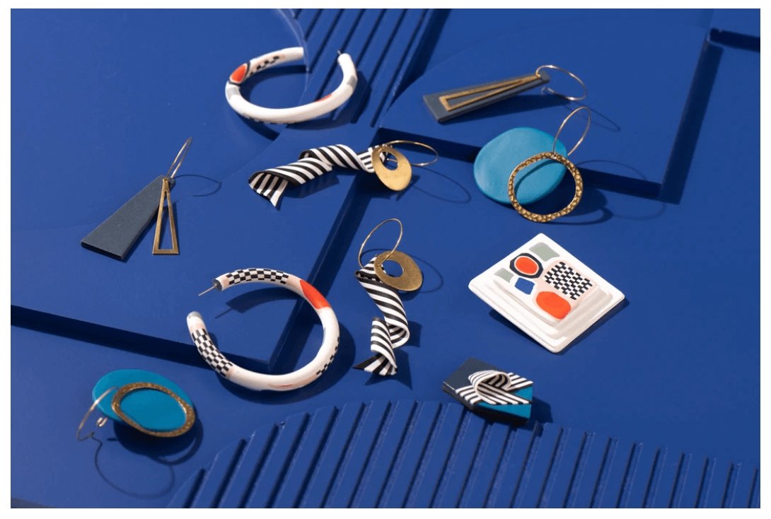 WEARABLE ART,  10 striking contemporary jewellery pieces resting on a bright royal blue background | Clac Clac Design